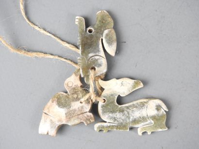 CHINA: Three carved stone pendants in the...