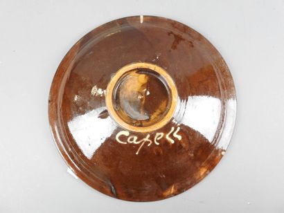 CAPELL : Deux grands plats en faïence. Signé...