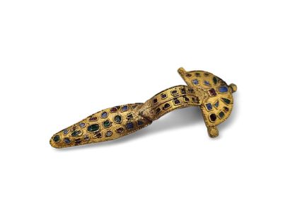 Replica of a barbarian arched fibula in gilt...