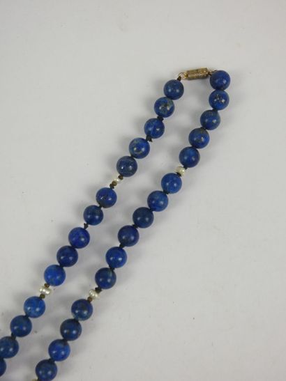 NECKLACE of lapis lazuli beads alternated...