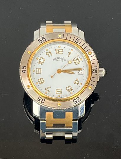 HERMES - Paris. Clipper steel and gold-plated...