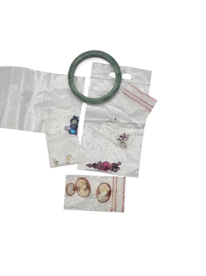 Lot of stones on paper including shell cameos,...