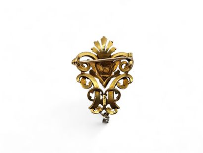 A solid 750-thousandths yellow gold brooch...