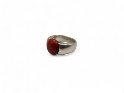 Silver ring centered with an orange imitation...