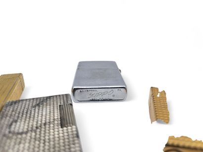 Set of 4 gilt and silver-plated metal lighters...