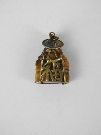Tiger's eye pendant featuring a Buddha with...