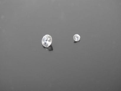 Two diamonds on paper (approx. 0.4 ct and...