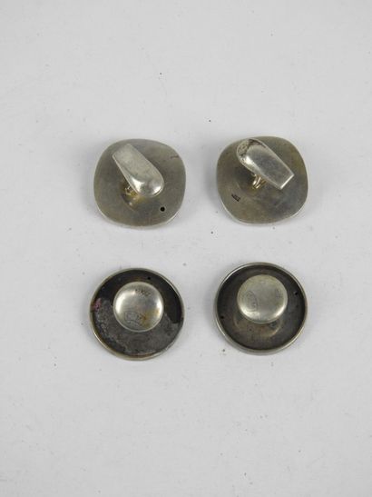 Two PAIRS OF SILVER HANDLEBUTTONS with arabesque...