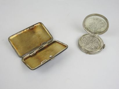 Set comprising a black enameled case with...