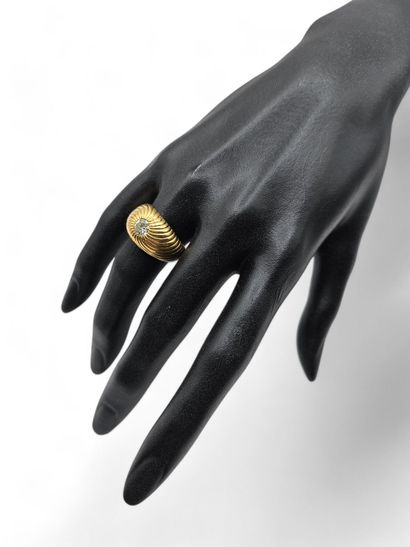 Yellow gold 750 thousandths chased ring centered...