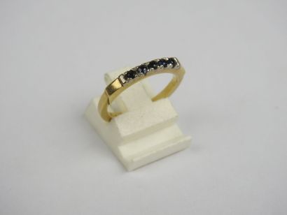 Half wedding band in 750 thousandths gold...