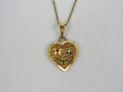 Three chains and pendant in 750 thousandths...