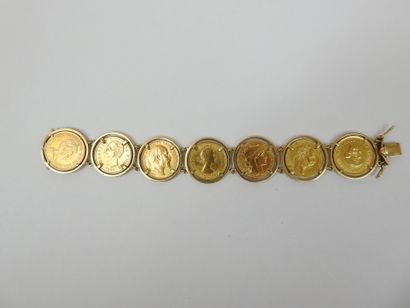 GOLD BRACELET adorned with 7 coins from various...