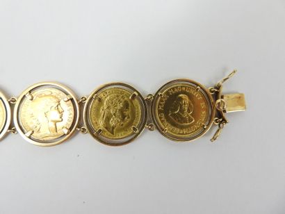 GOLD BRACELET adorned with 7 coins from various...