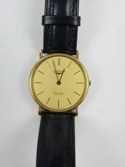 LONGINES. Gold-plated metal watch, round...