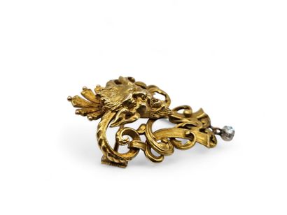 A solid 750-thousandths yellow gold brooch...