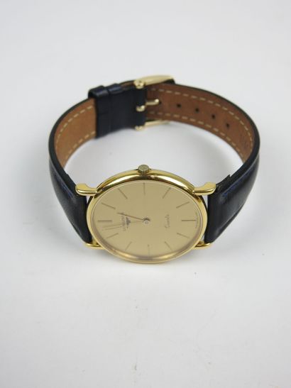 LONGINES. Gold-plated metal watch, round...