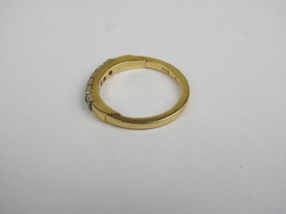 Half wedding band in 750 thousandths gold...