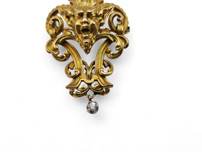 A solid 750-thousandths yellow gold brooch...