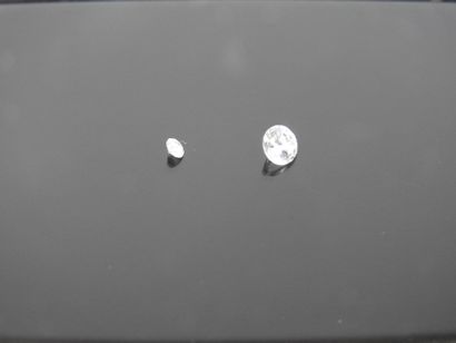 Two diamonds on paper (approx. 0.4 ct and...