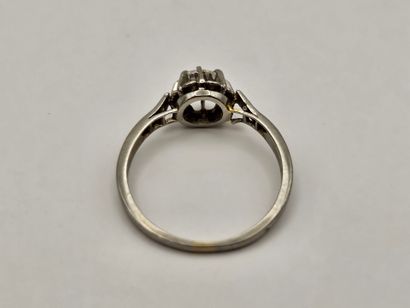 Solitaire platinum ring centered on a round...