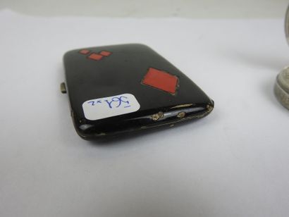 Set comprising a black enameled case with...