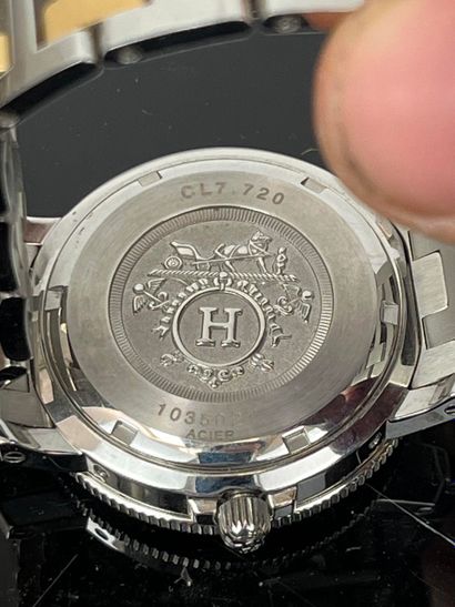 HERMES - Paris. Clipper steel and gold-plated...