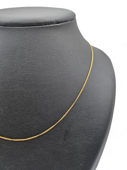 Adjustable 750 thousandths yellow gold chain...