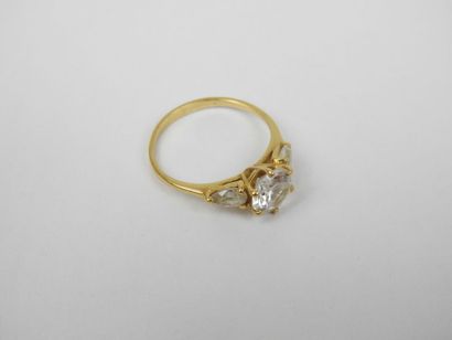 18K gold ring set with three white stones....