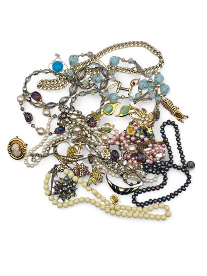 A large lot of costume jewelry in gold and...
