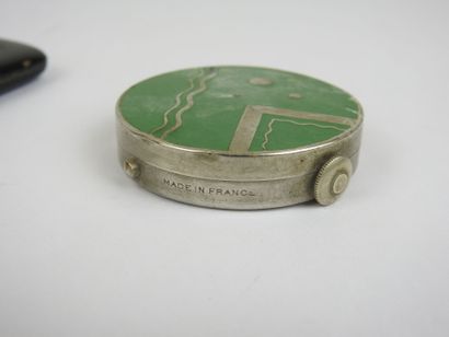 Set comprising a black enameled case with...