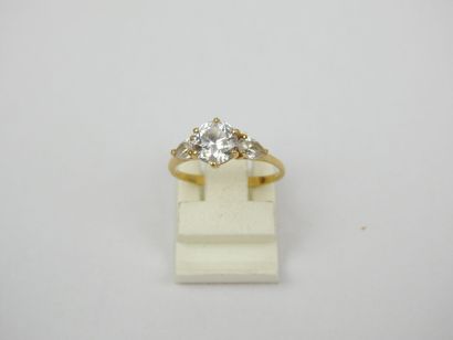 18K gold ring set with three white stones....