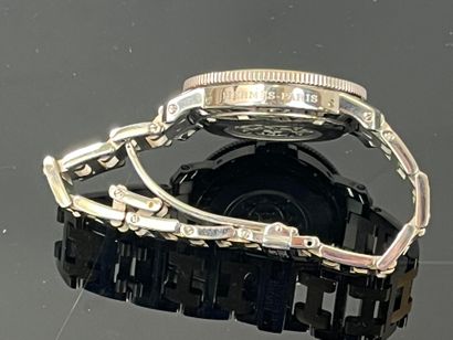 HERMES - Paris. Clipper steel and gold-plated...