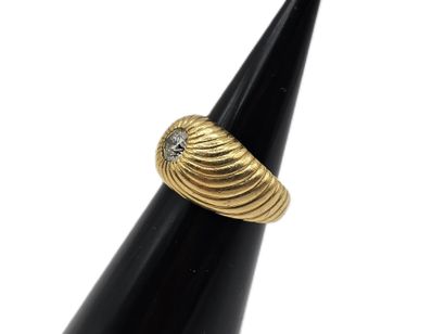 Yellow gold 750 thousandths chased ring centered...