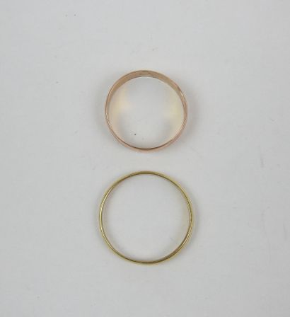 Two yellow gold wedding bands. Weight: 3.14...