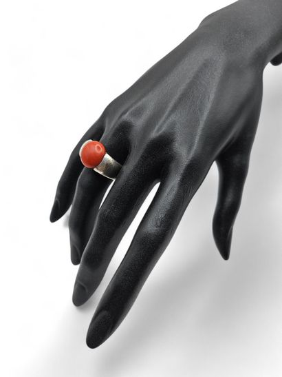 Silver ring centered with an orange imitation...