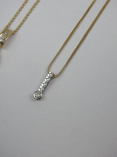 TWO CHAINS in 750/1000th yellow gold with...