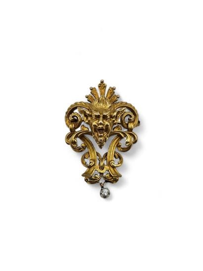 A solid 750-thousandths yellow gold brooch...