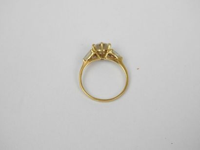 18K gold ring set with three white stones....