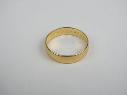 Wedding band in 750 thousandths gold, engraved...
