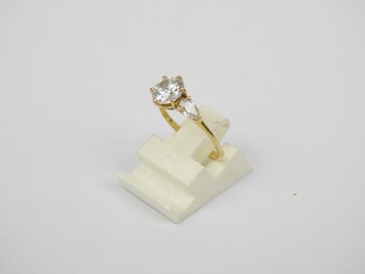 18K gold ring set with three white stones....