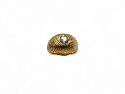 Yellow gold 750 thousandths chased ring centered...