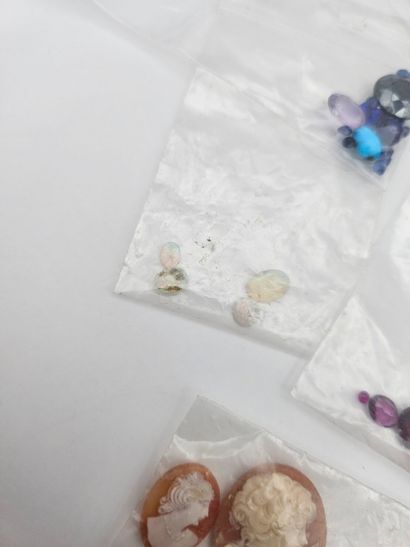 Lot of stones on paper including shell cameos,...