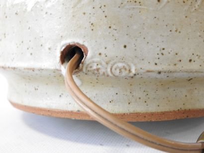 Cylindrical lamp base in beige-glazed stoneware...