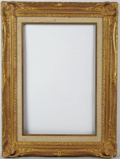 BARE FRAME in wood and gilded stucco, decorated...