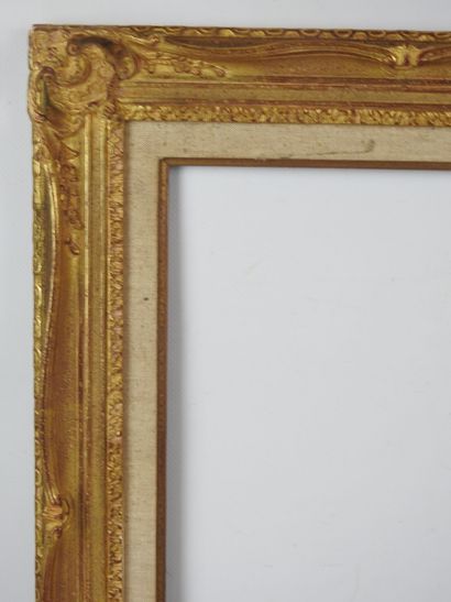 BARE FRAME in wood and gilded stucco, decorated...