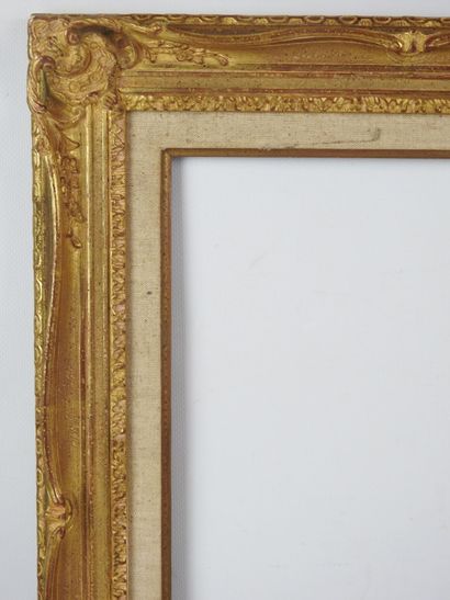 BARE FRAME in wood and gilded stucco, decorated...