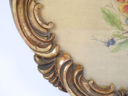 Carved wood and gilded stucco oval frame...