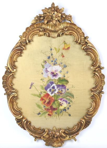 Carved wood and gilded stucco oval frame...