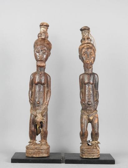 Baule Ivory Coast: Two carved wooden statues...